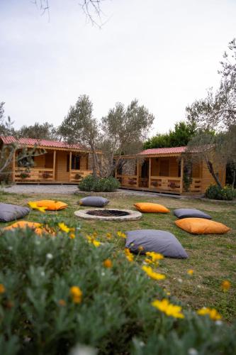a yard with many pillows on the grass at Bir Dem Urla in Urla