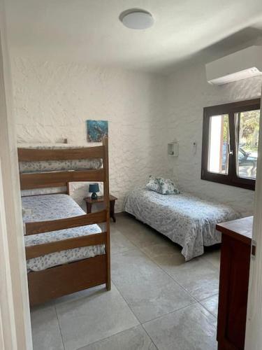 En eller flere senge i et værelse på Casa sul mare con giardino Sardegna Sant'Antioco