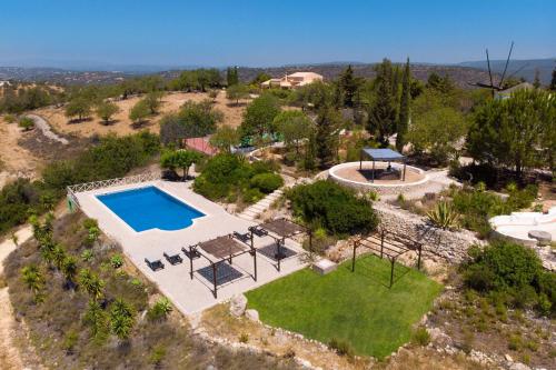 an aerial view of a villa with a swimming pool at Quinta Molinum Ad Mare by Algarve Holidays in Boliqueime