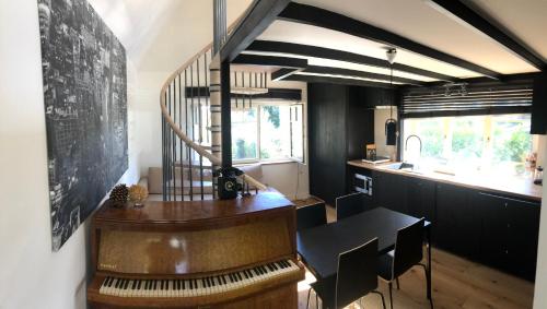 a dining room with a table and a chalkboard at Genval-BNB-Lake in Genval