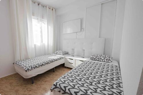 Postel nebo postele na pokoji v ubytování Apartamentos Sol&Mar