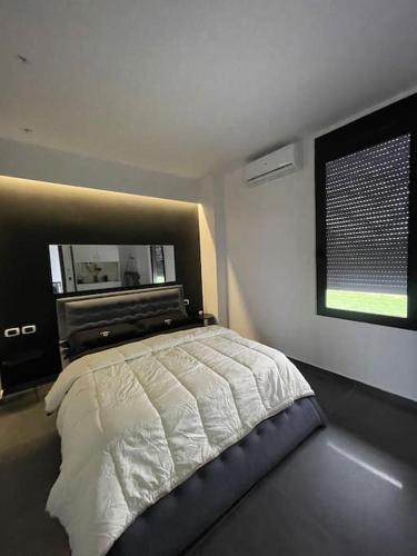Ένα ή περισσότερα κρεβάτια σε δωμάτιο στο Sueño Luxury Villa