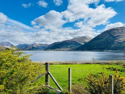 a view of a lake with mountains in the background at Avoca Lodge in Fort William