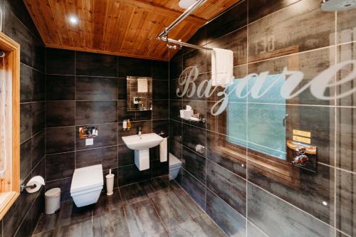 a bathroom with a sink and a toilet at Bazare Lodge in Great Ayton