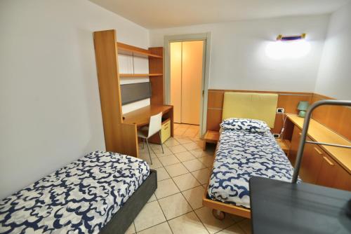 Katil atau katil-katil dalam bilik di [Lago di Garda a 200 metri] La casa di Anna