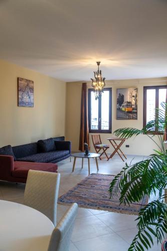 a living room with a couch and a table at Angoni Villa in Durrës