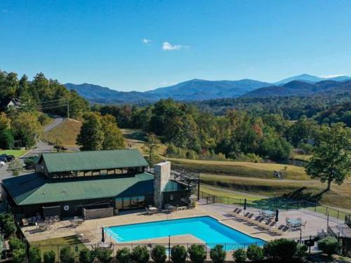 an aerial view of a building with a swimming pool at Mountain Bliss in Townsend