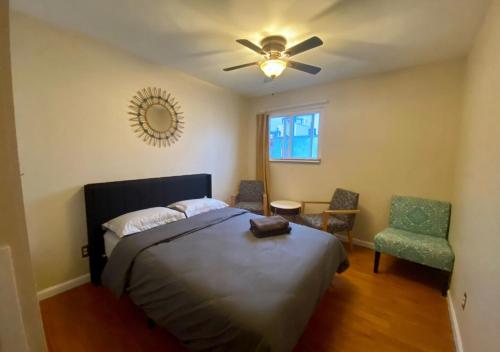 a bedroom with a bed and a ceiling fan at Historic Townhouse Oasis with En-suite Bathroom in Philadelphia