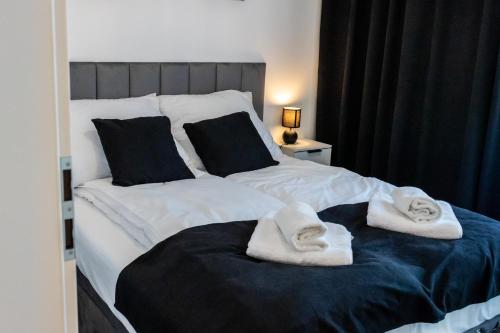 En eller flere senge i et værelse på DS Apartamenty Jaśminowa