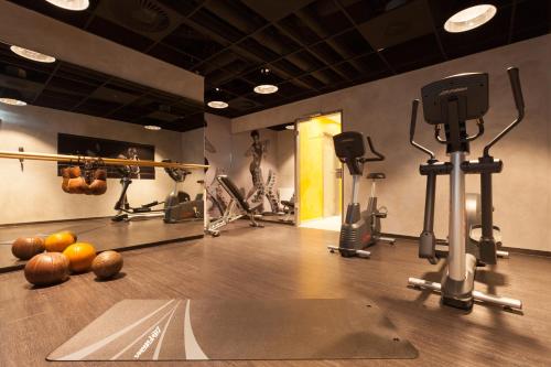 a gym with a bowling alley with balls on the floor at Vienna House Easy by Wyndham Osnabrück City & Apartments in Osnabrück