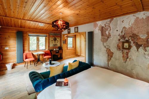 a living room with a couch and a map on the wall at Bazare Lodge in Great Ayton