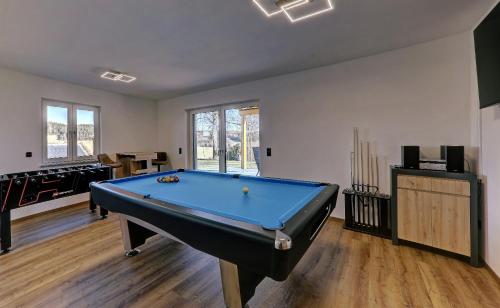 a living room with a pool table in it at Landhaus Rachelblick in Eppenschlag