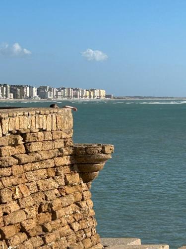 a stone wall next to a body of water at Domus Alberta in Lecce