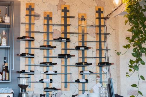 a wall with wine racks on it at DUKA Hotel in Vlorë