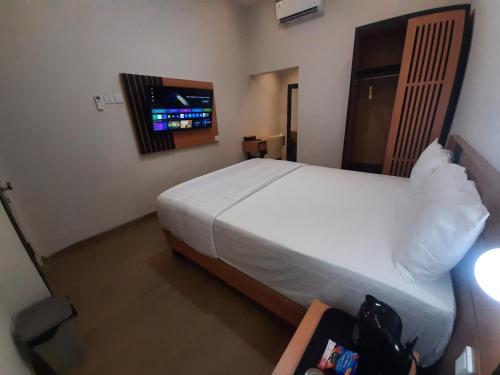 Giường trong phòng chung tại Griya Endika Syariah