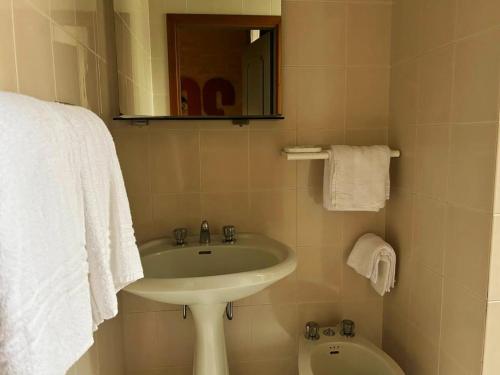 a bathroom with a sink and a toilet at Albergo Mango in Francavilla in Sinni