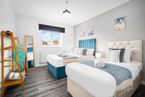 a bedroom with two beds and a ladder in it at New Luxury Apartment - Cradley Heath - 2MH - Parking - Netflix - Top Rated in Birmingham