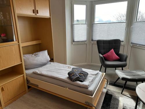 Postel nebo postele na pokoji v ubytování Haus Südwind Herzmuschel - klein aber fein