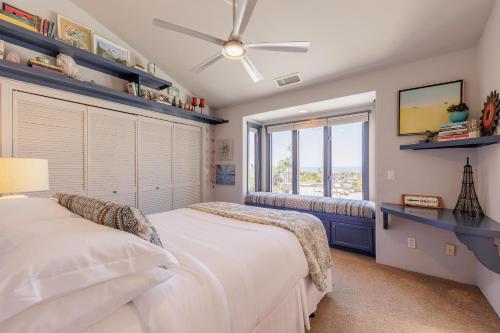 a bedroom with two beds and a window at SB-316 - Sunset Hacienda in Solana Beach