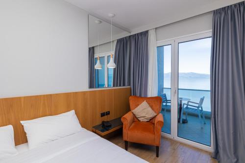 Postel nebo postele na pokoji v ubytování DUKA Hotel