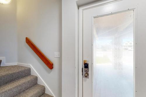 a door leading to a stairway with a handle at Whelk #22B-CAC in Buxton