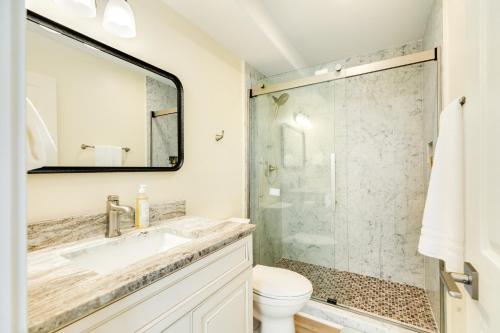 a bathroom with a toilet and a sink and a shower at Beach & Bay Views - Unit 2 - Bluewater Beach House in Surfside Beach