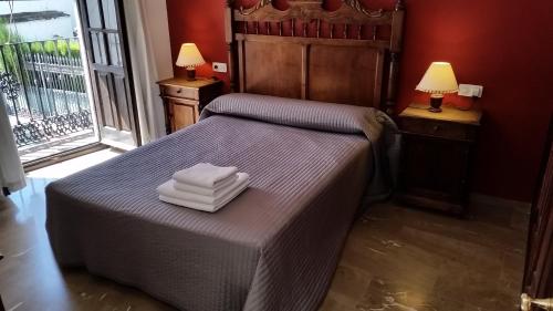 Una cama o camas en una habitación de Casa Rondeña