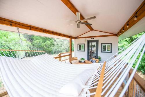 a hammock in a house with a porch at Bluebonnet Trail in Waco