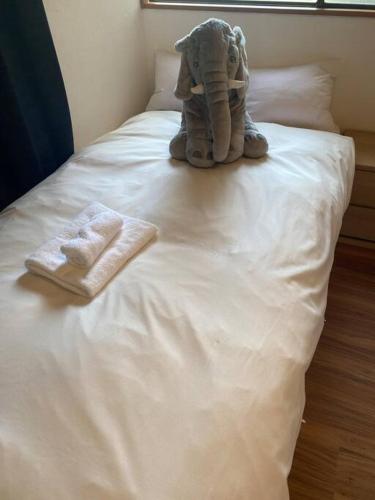 Ein Bett oder Betten in einem Zimmer der Unterkunft 新宿家族連れ４LDKの子供つれ5星