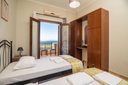 Ένα ή περισσότερα κρεβάτια σε δωμάτιο στο Leyenia Serenity Houses