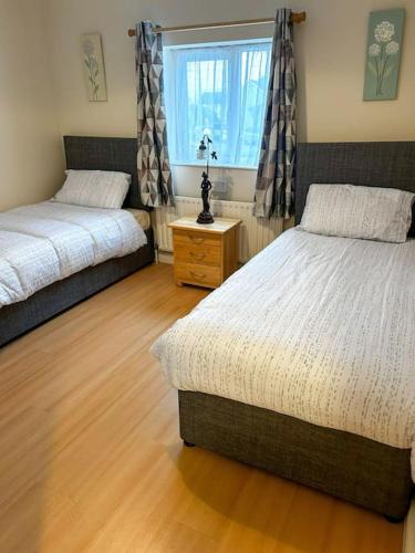 Postel nebo postele na pokoji v ubytování Marian Place House