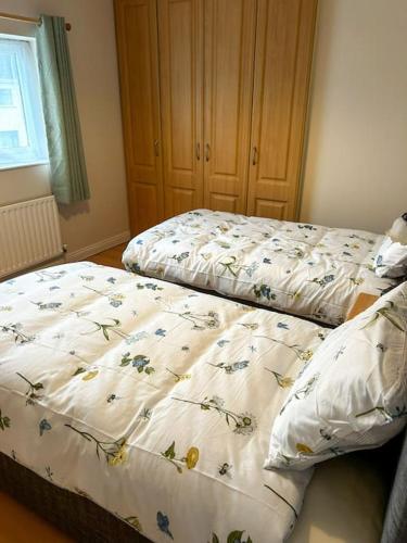 Postel nebo postele na pokoji v ubytování Marian Place House