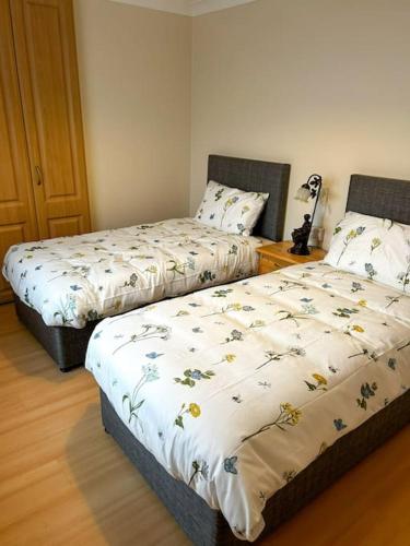 Postel nebo postele na pokoji v ubytování Marian Place House