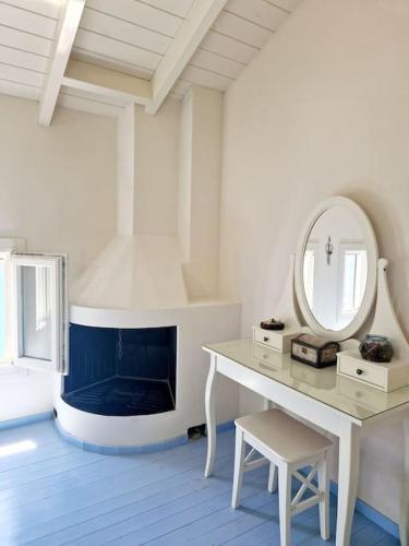 a room with a dressing table and a mirror at Aτos Comfort Villa in Asos