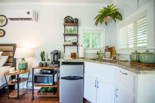 a kitchen with white cabinets and a counter top at Bluebonnet Trail in Waco