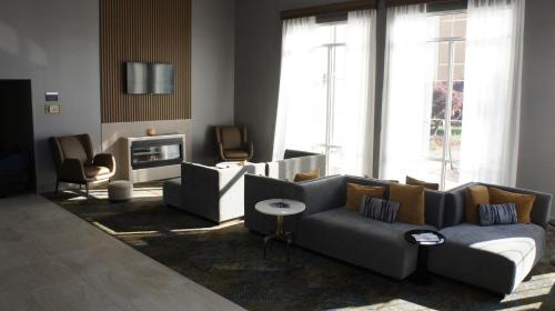 a living room with two couches and a fireplace at Hawthorn Extended Stay by Wyndham Knoxville in Knoxville