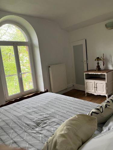 Postel nebo postele na pokoji v ubytování Grand appartement à la campagne