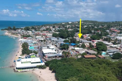 an aerial view of a town next to the beach at Sandy Shores Retreat Beach Apt in Cabo Rojo in Boqueron