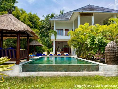 a swimming pool in front of a villa at Paradise West-Bali in Palasari