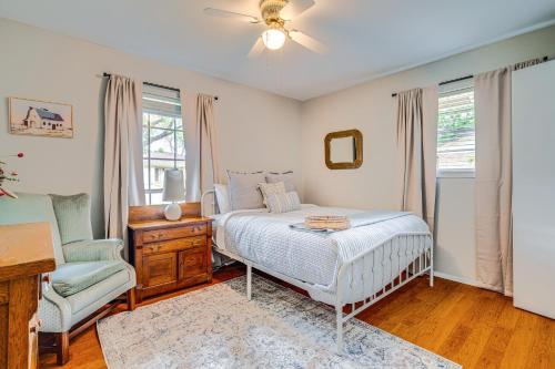 a bedroom with a bed and a chair and a window at Game Room and Yard Pet-Friendly Round Rock Gem in Round Rock