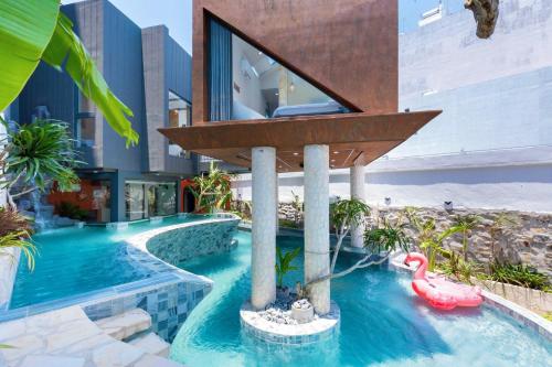 a house with a swimming pool with a pool noodleitatingitatingitatingitatingitating at Wabi Sabi Villa * Hồ Bơi Thác Nước 140 m2 * Phòng Karaoke Thủy Cung in Vung Tau