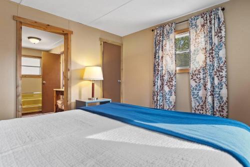 a bedroom with a large bed and a window at Blue Pine Retreat in Lead