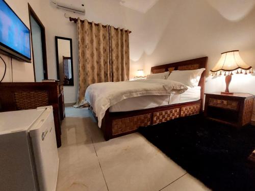 Ένα ή περισσότερα κρεβάτια σε δωμάτιο στο Hotel Residencial Ramire-Tour