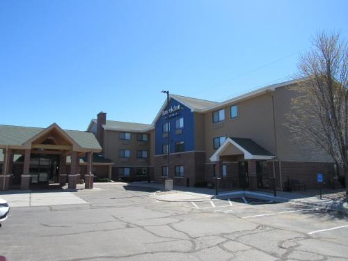 a hotel parking lot in front of a building at AmericInn by Wyndham Lincoln South in Lincoln