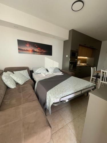 מיטה או מיטות בחדר ב-Apartman Loren
