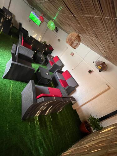 an overhead view of a living room with red furniture at Nexus Xpress Hotel in Abuja