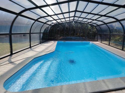 a hot tub in a dome with a glass enclosure at VILLA SAMUELA in Neive