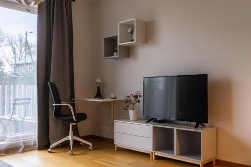 TV a/nebo společenská místnost v ubytování Vibu Apartment