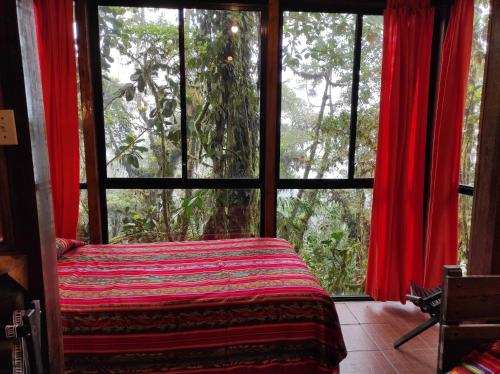 Postel nebo postele na pokoji v ubytování Bellavista Cloud Forest Lodge & Private Protected Area