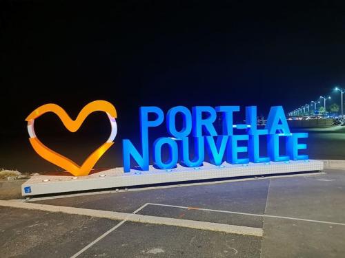 a sign that reads porta novolele at night at Appartement avec terrasse Classé in Port-la-Nouvelle